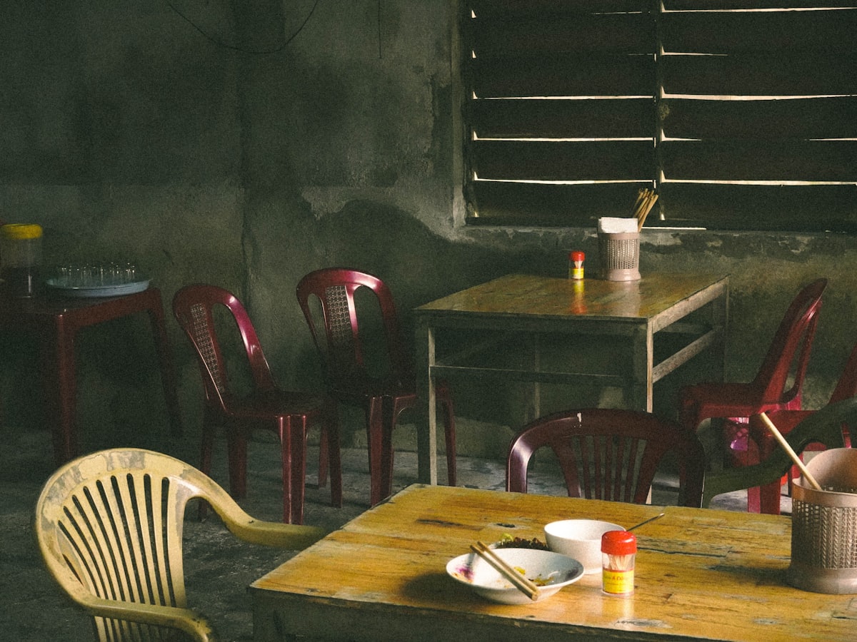 Empty tables and chairs in the shop before opening